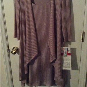 NWT. Beautiful sleeveless dress with rap attached